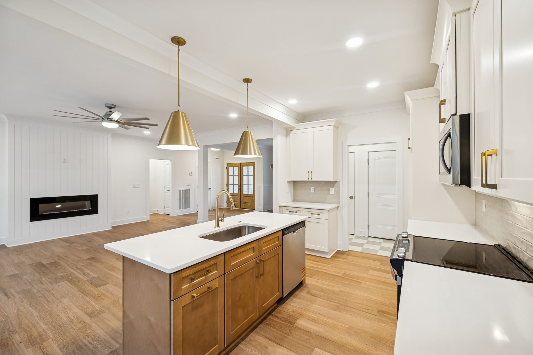 1561 Opossum Paw Road Beechgrove, TN 37018 - Photo 31 of 62 a kitchen with a sink a counter top space stainless steel appliances and a center island