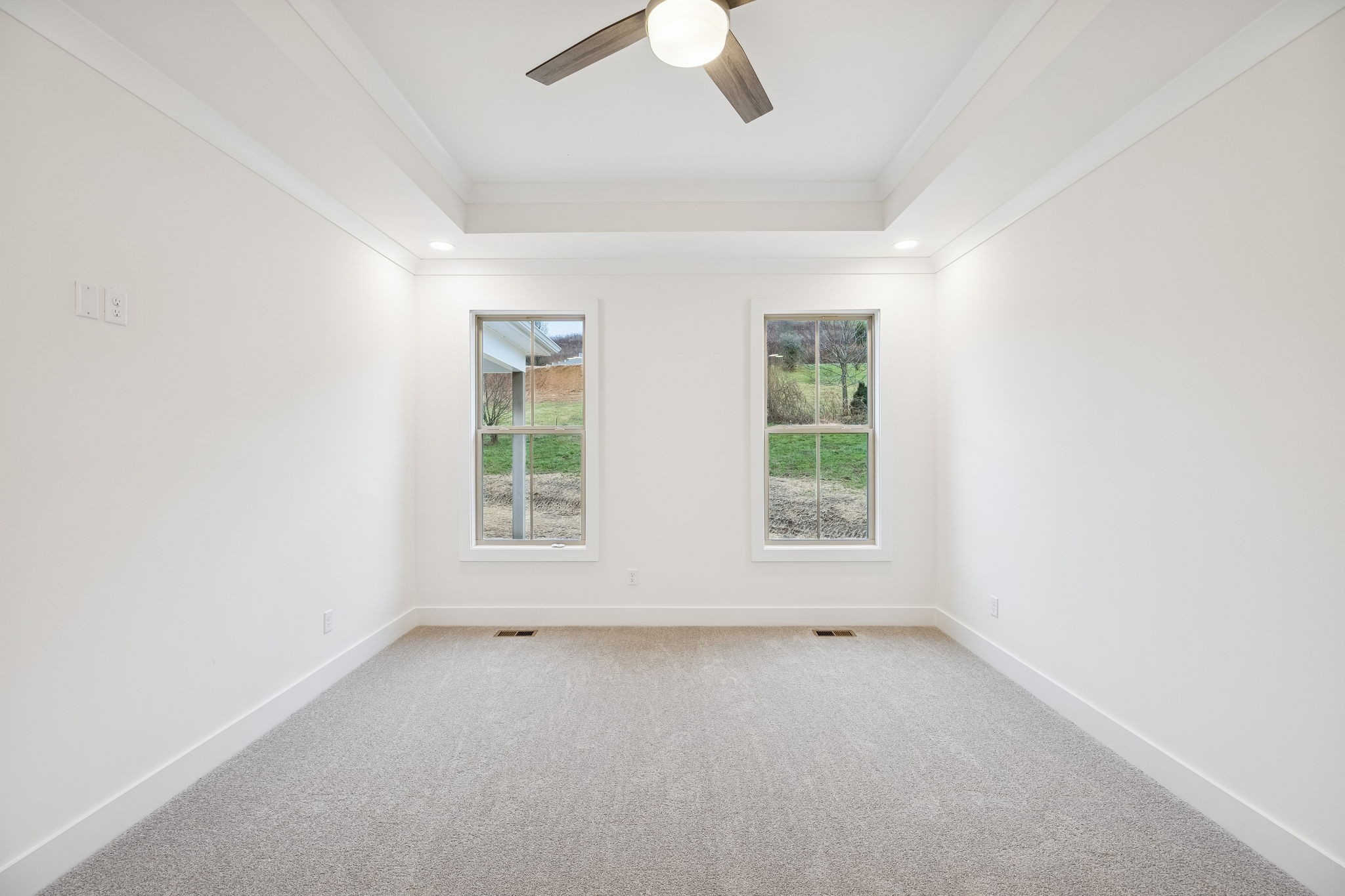 1561 Opossum Paw Road Beechgrove, TN 37018 - Photo 33 of 62 an empty room with a ceiling fan and window