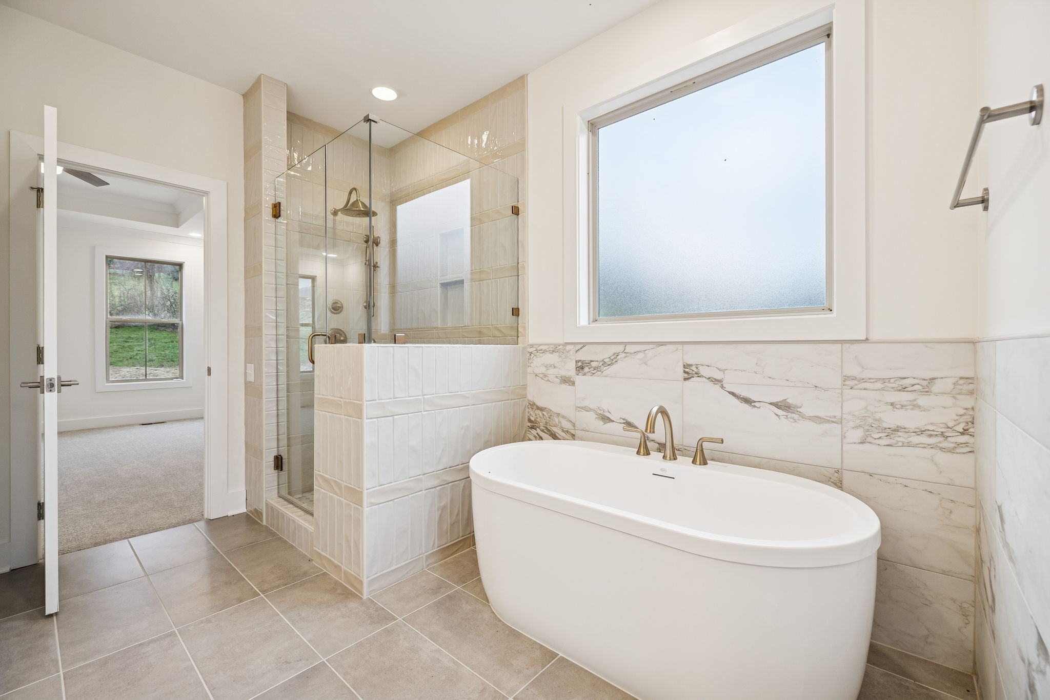 1561 Opossum Paw Road Beechgrove, TN 37018 - Photo 36 of 62 a white bath tub sitting next to a bathroom sink