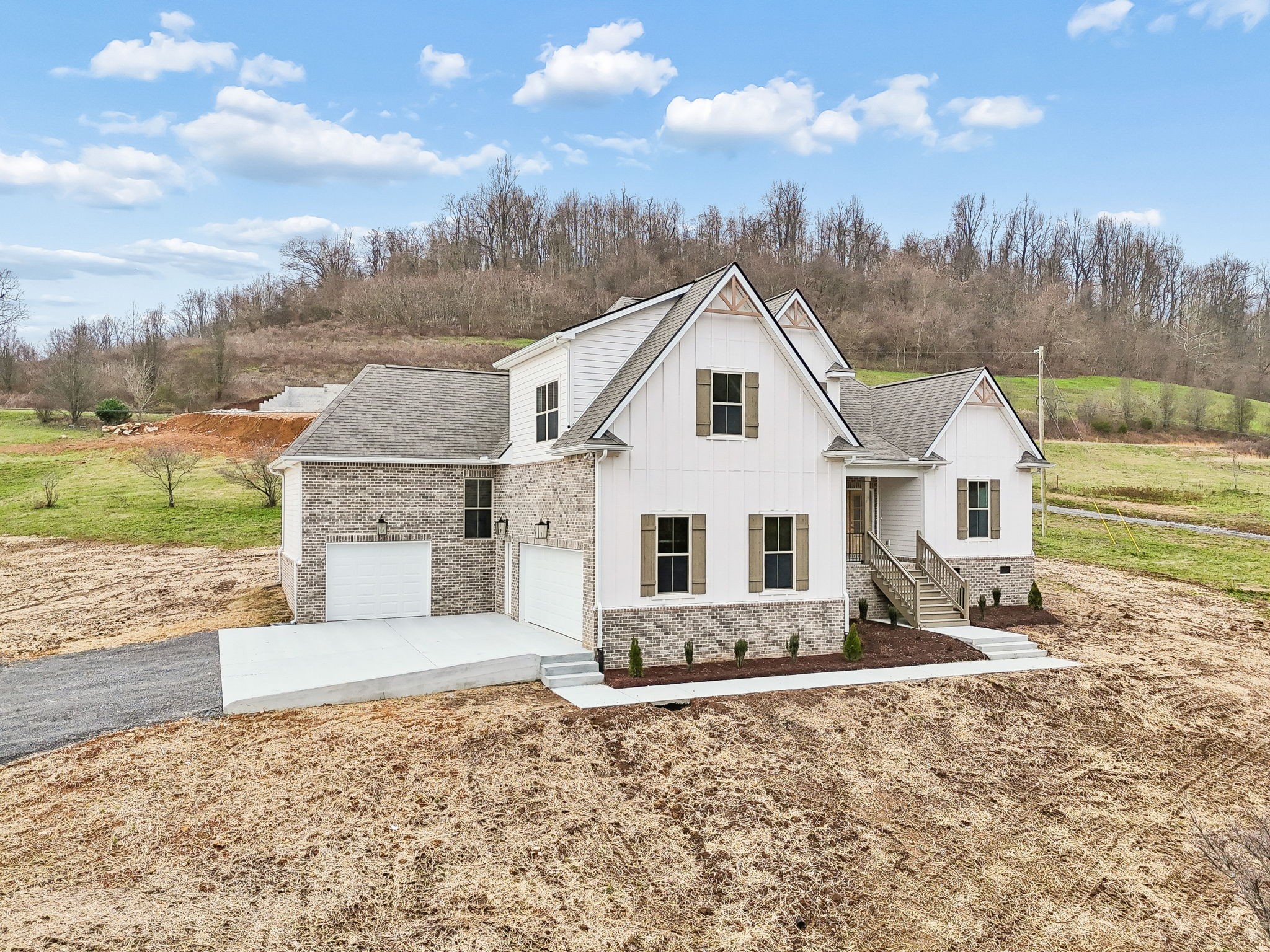 1561 Opossum Paw Road Beechgrove, TN 37018 - Photo 4 of 62 a view of a white house with a yard