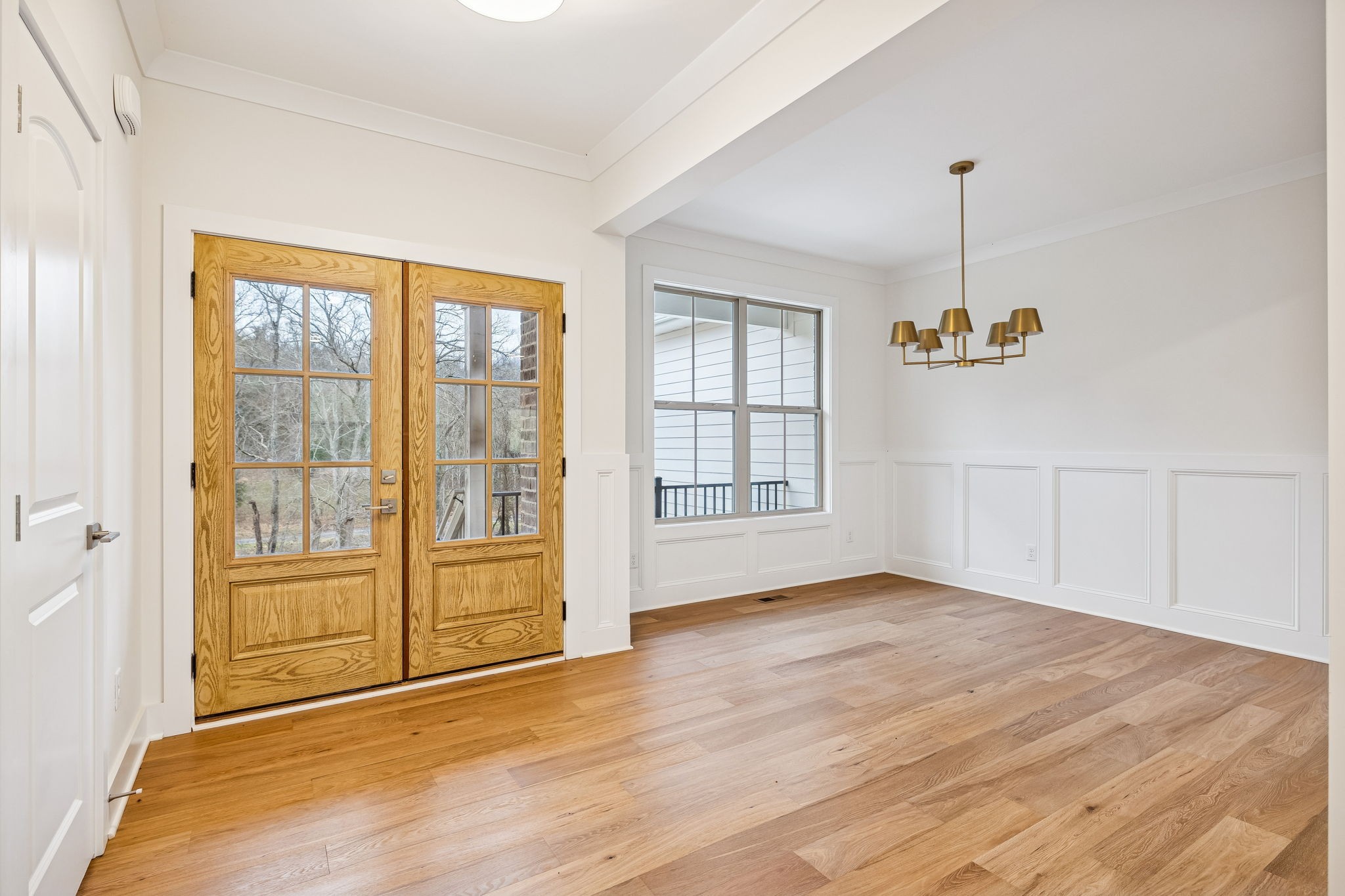 1561 Opossum Paw Road Beechgrove, TN 37018 - Photo 9 of 62 a view of an empty room with a window and wooden floor