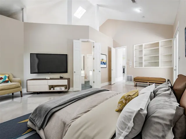 a bathroom with a granite countertop sink mirror and bathtub