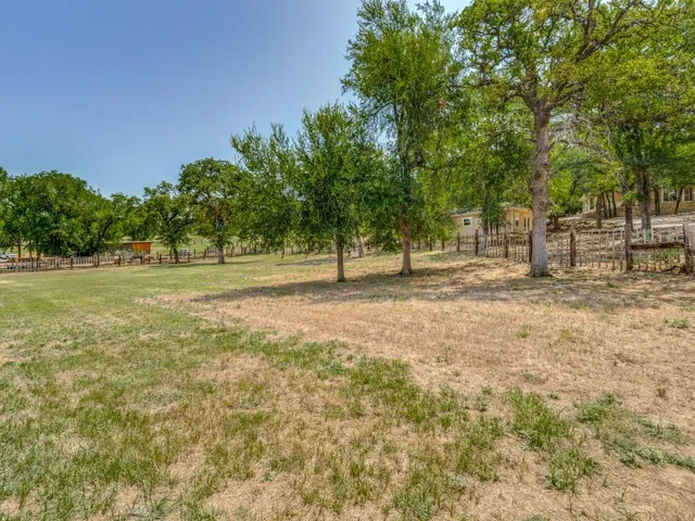 a view of outdoor space with deck and trees