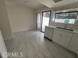 a view of wooden floor and a sink