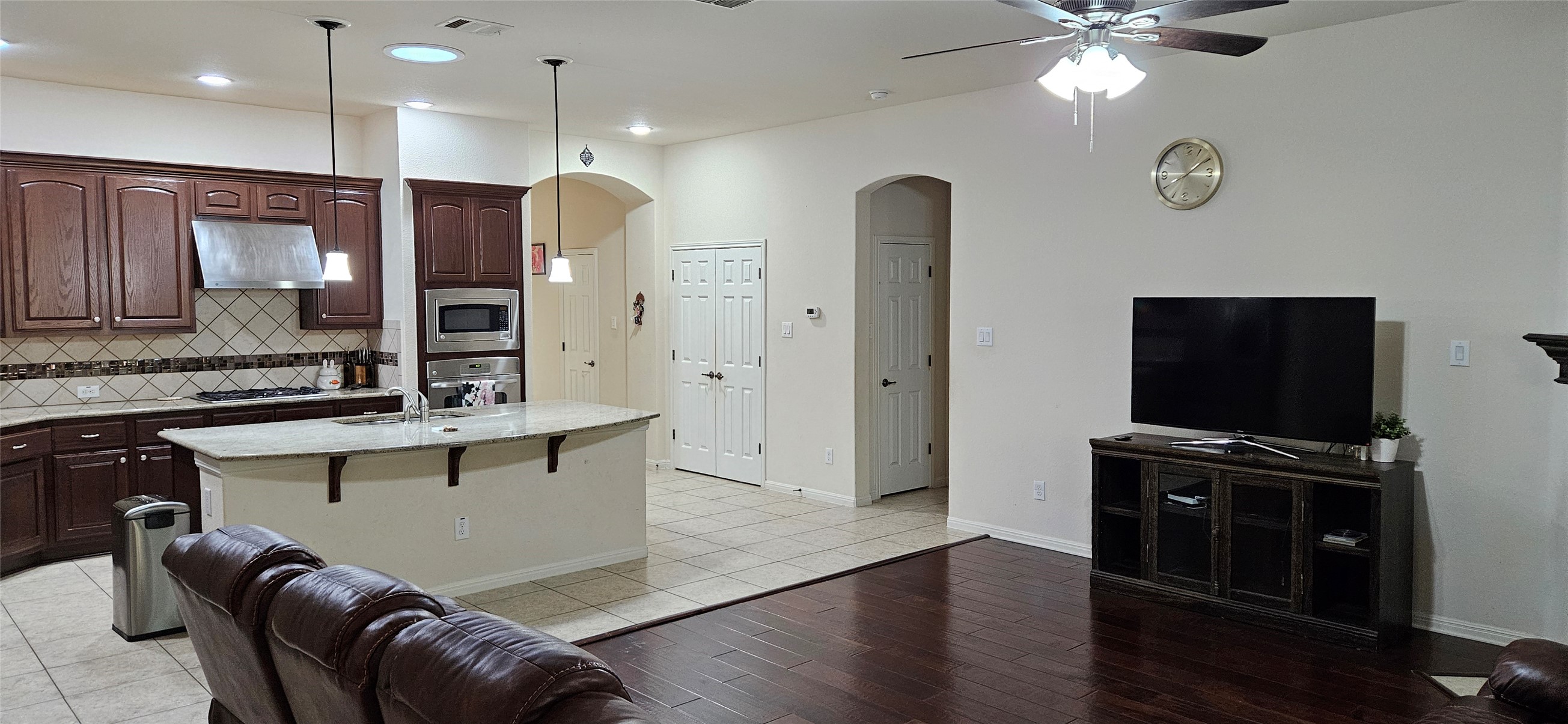 116 Azimuth Drive Austin, TX 78717 - Photo 30 of 33 a living room with stainless steel appliances kitchen island granite countertop furniture a sink and a flat screen tv