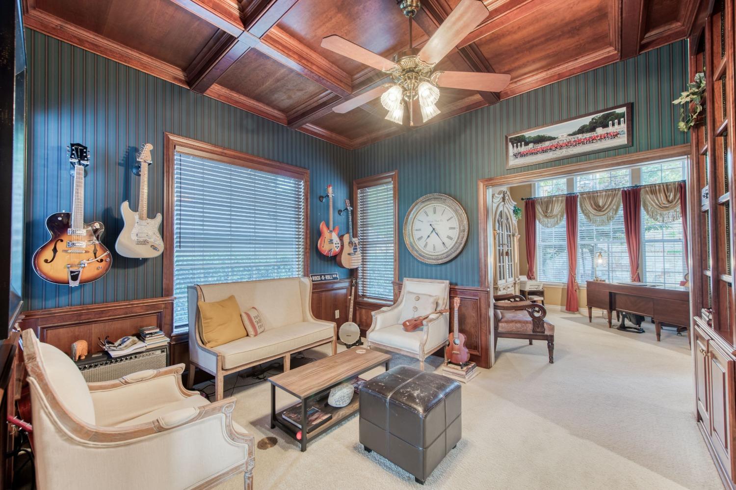 21672 Westmere Lane Friant, CA 93626 - Photo 11 of 80 a living room with furniture a chandelier and a large window