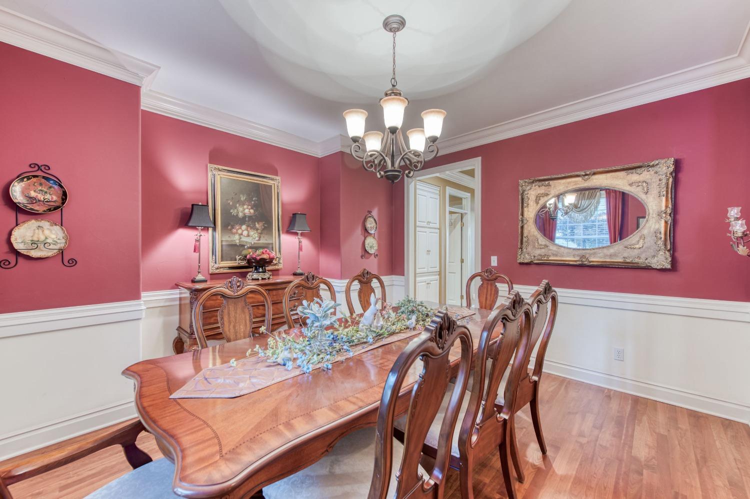 21672 Westmere Lane Friant, CA 93626 - Photo 16 of 80 a view of a dining room with furniture and wooden floor