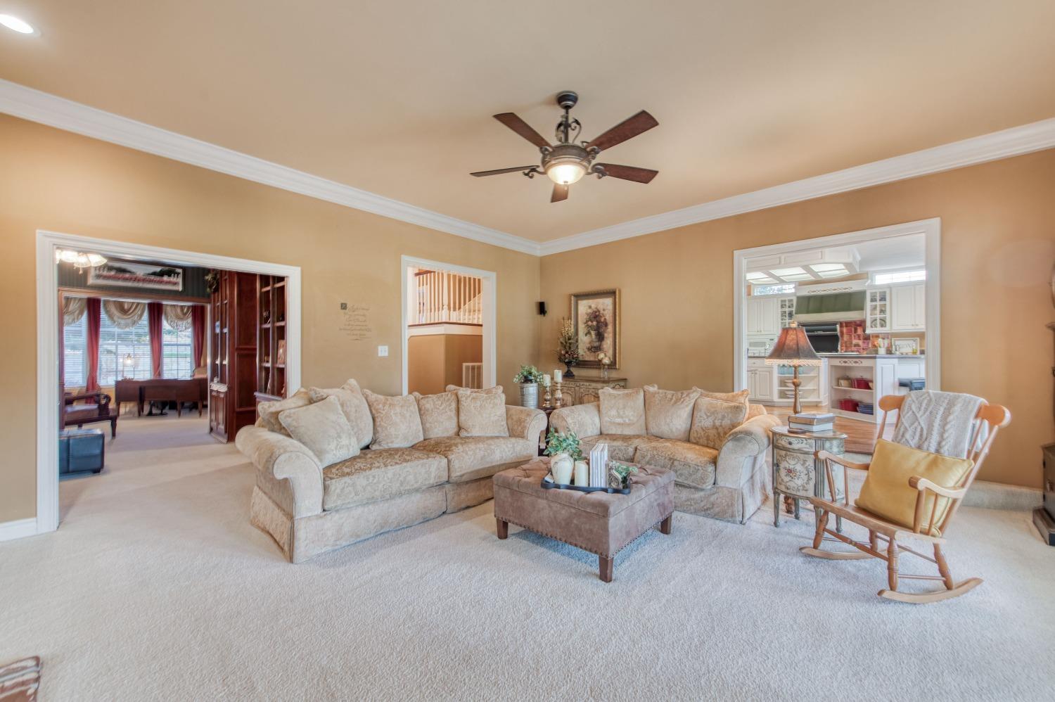 21672 Westmere Lane Friant, CA 93626 - Photo 21 of 80 a living room with furniture and a ceiling fan