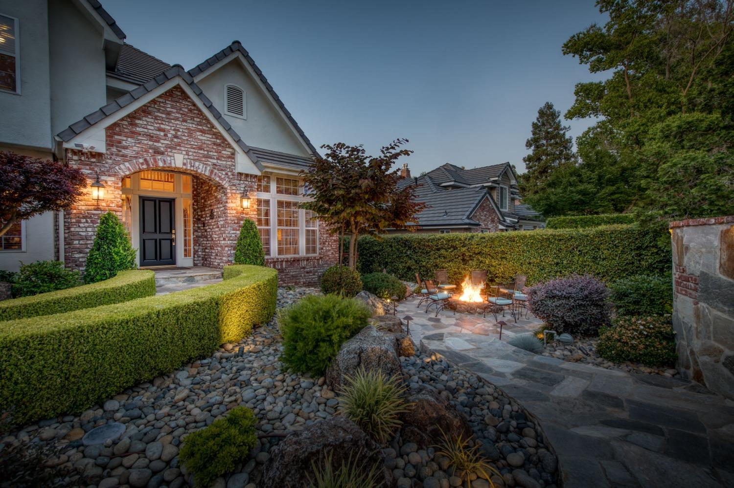 21672 Westmere Lane Friant, CA 93626 - Photo 3 of 80 a front view of a house with a yard