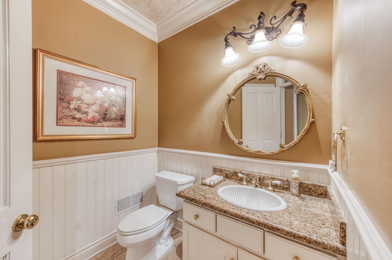 21672 Westmere Lane Friant, CA 93626 - Photo 34 of 80 a bathroom with a toilet sink and mirror