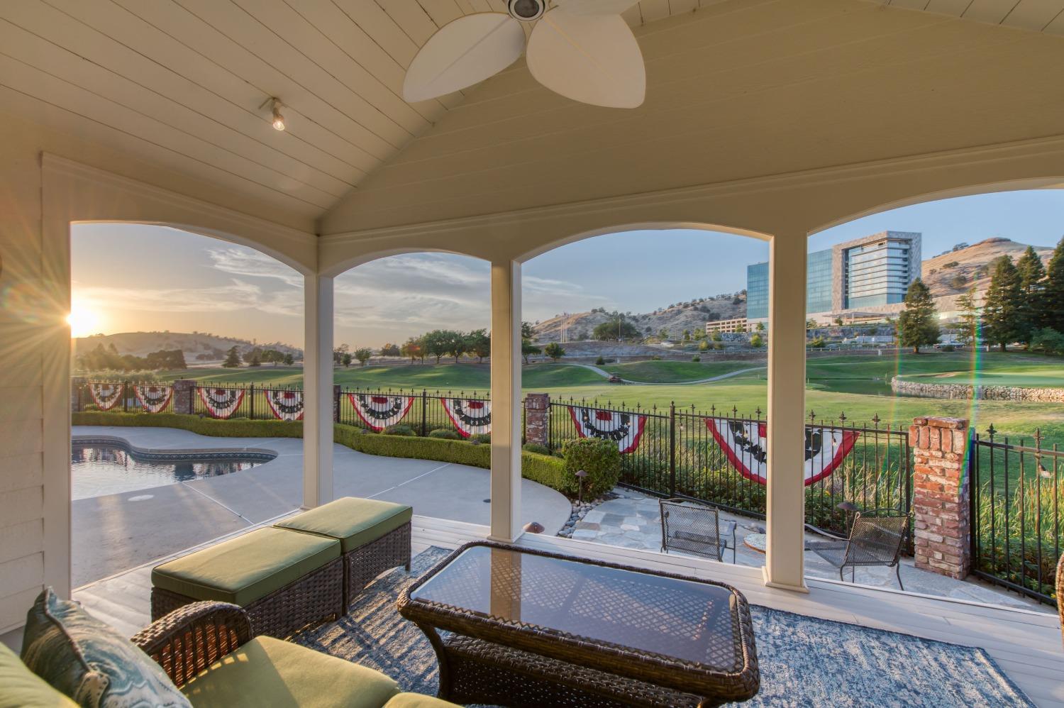21672 Westmere Lane Friant, CA 93626 - Photo 51 of 80 a living room with furniture and a floor to ceiling window