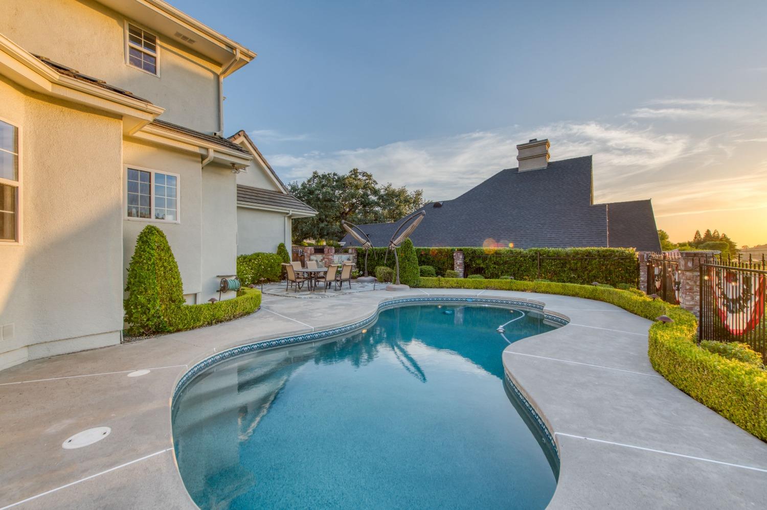 21672 Westmere Lane Friant, CA 93626 - Photo 53 of 80 a view of a swimming pool with a patio