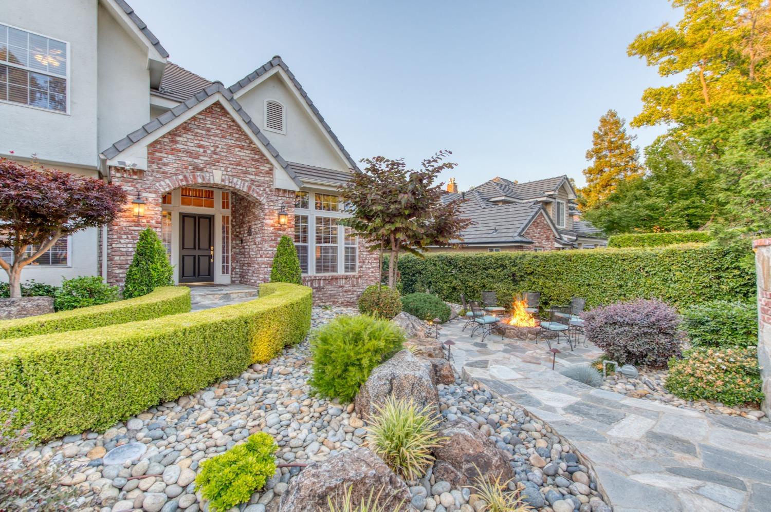 21672 Westmere Lane Friant, CA 93626 - Photo 59 of 80 a front view of a house with a garden