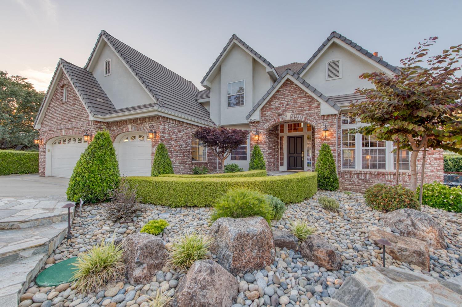 21672 Westmere Lane Friant, CA 93626 - Photo 60 of 80 a front view of a house with garden