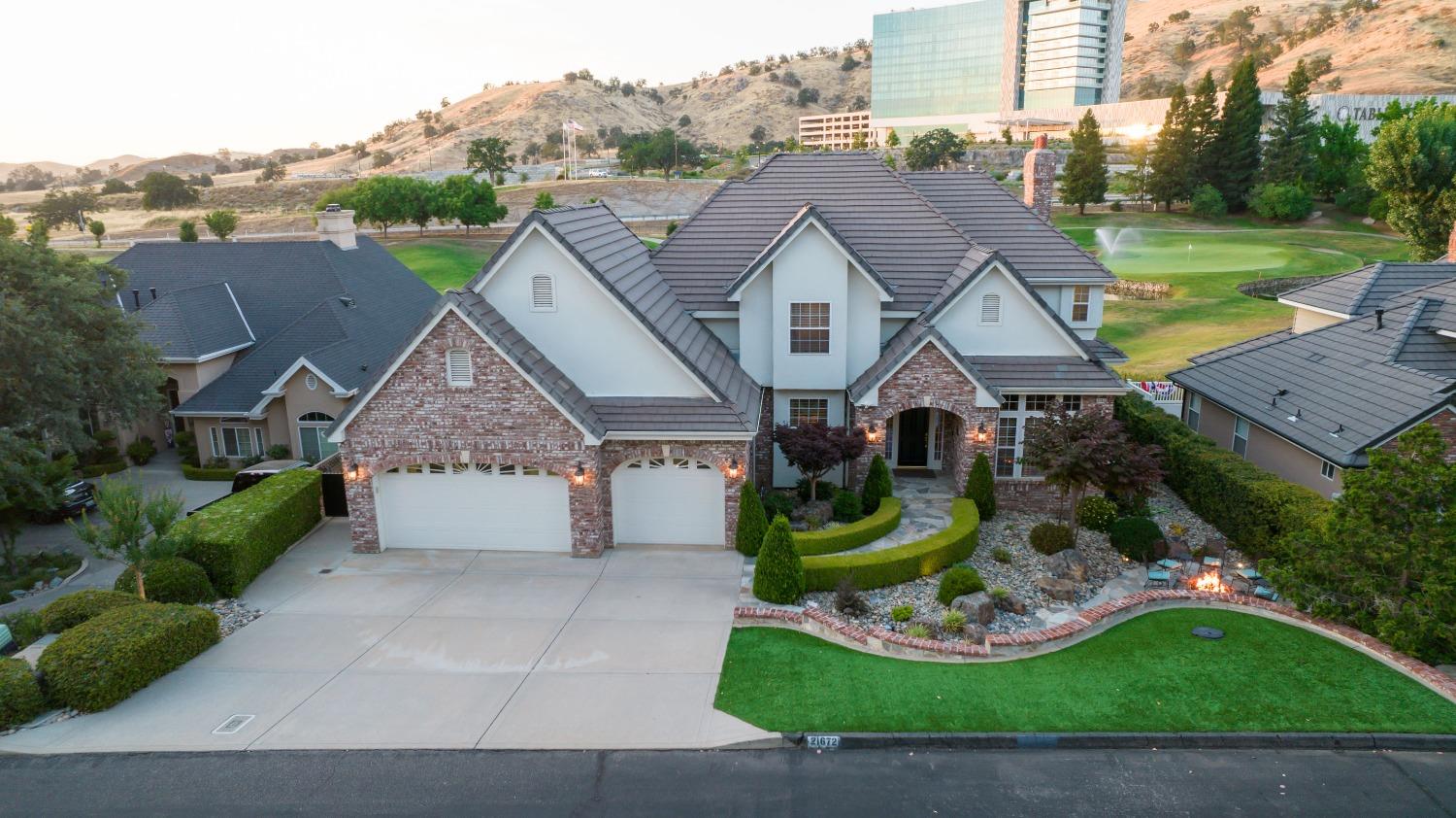 21672 Westmere Lane Friant, CA 93626 - Photo 72 of 80 a aerial view of a house with a yard and potted plants