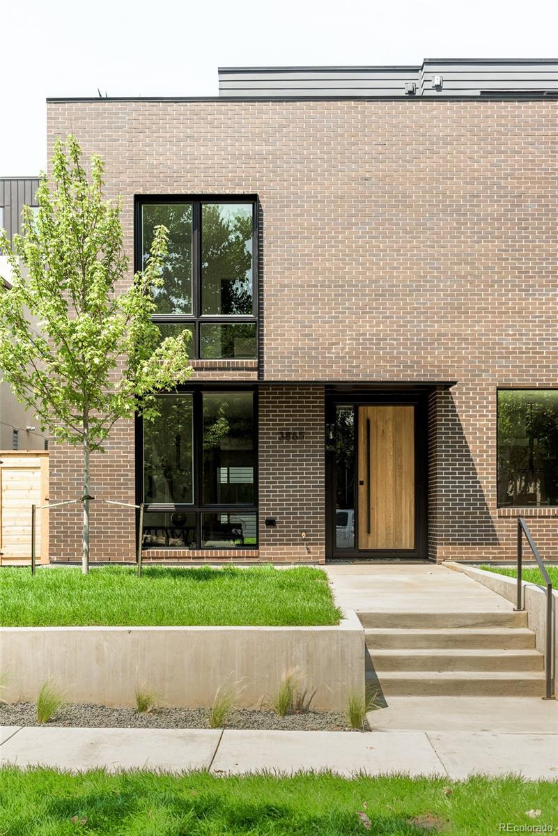 3865 Stuart Street Denver, CO 80212 - Photo 1 of 32 a view of a house with a yard and large windows