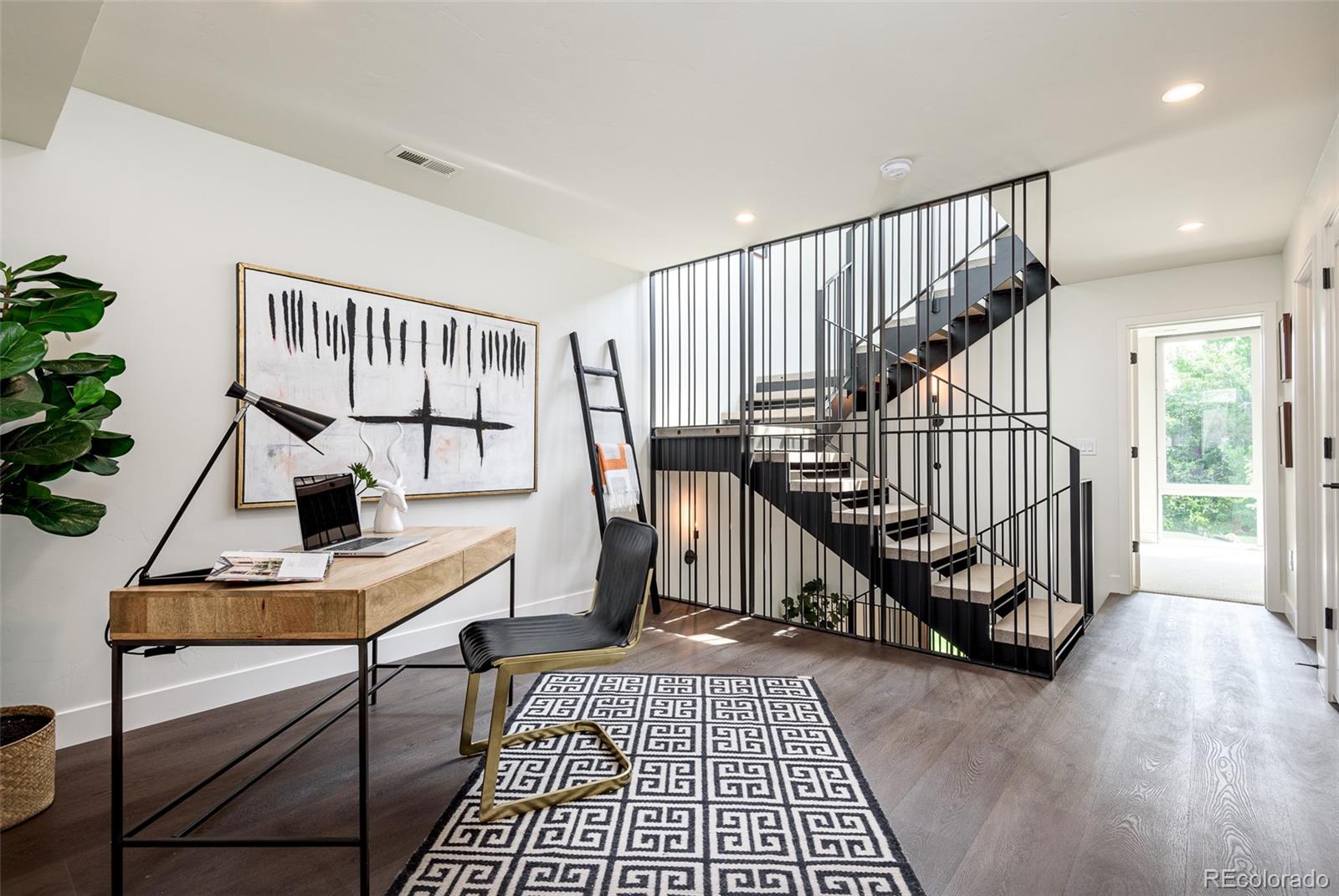 3865 Stuart Street Denver, CO 80212 - Photo 15 of 32 a view of entryway with wooden floor and stairs