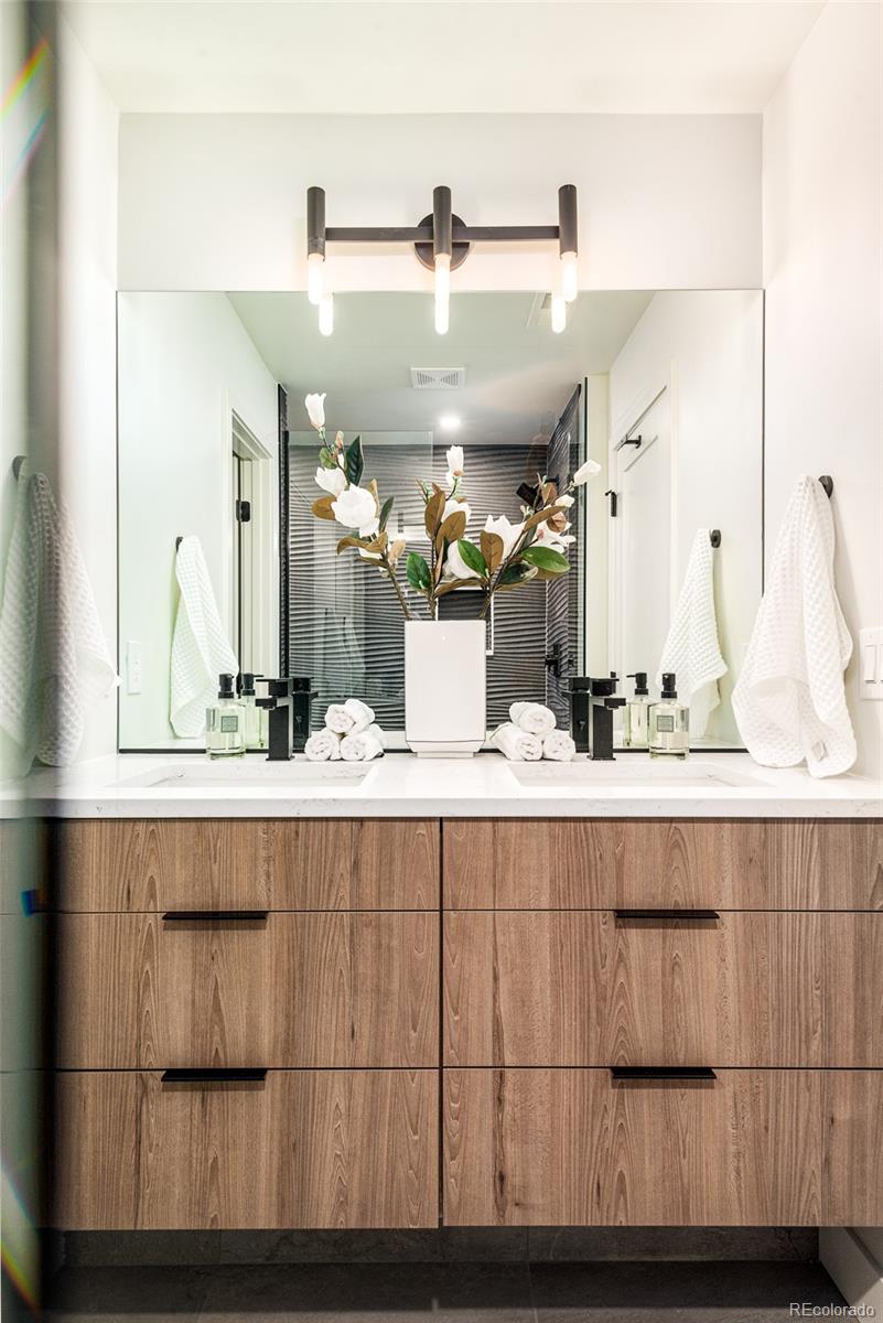 3865 Stuart Street Denver, CO 80212 - Photo 20 of 32 a bathroom with a sink and mirror