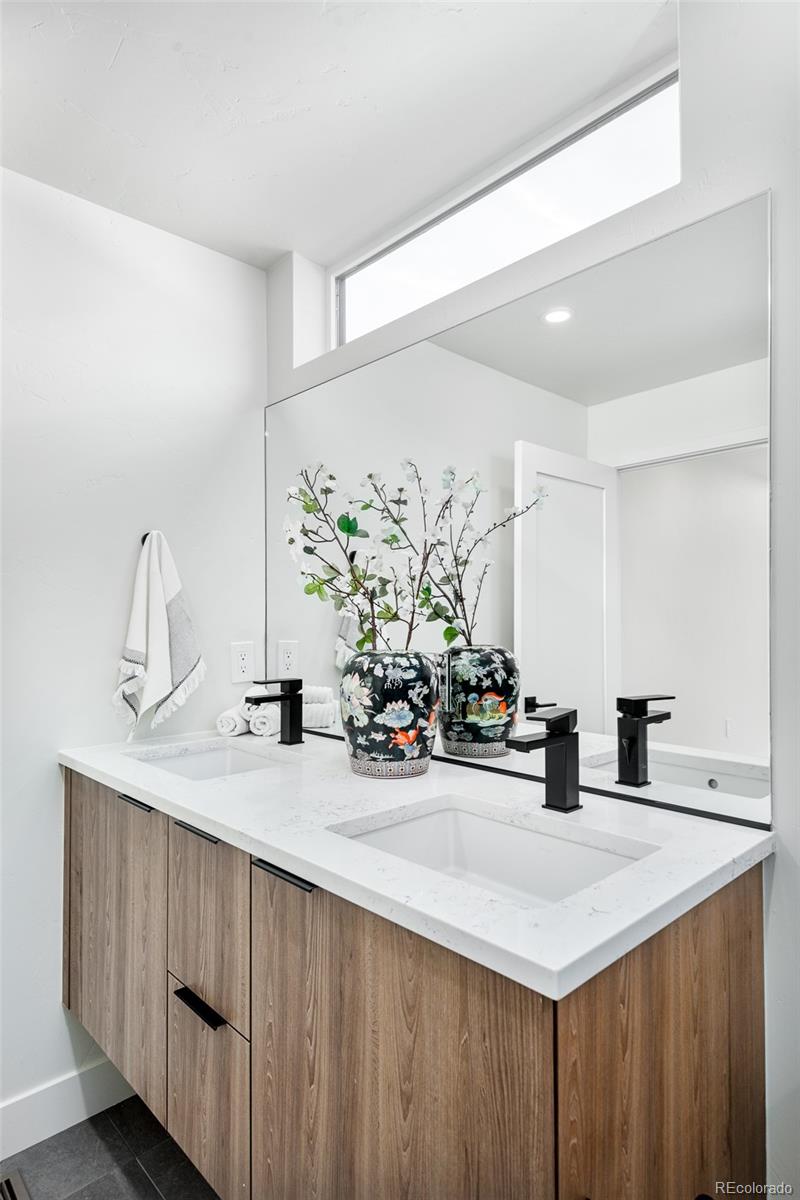 3865 Stuart Street Denver, CO 80212 - Photo 25 of 32 a kitchen with a sink a cabinets and potted plant