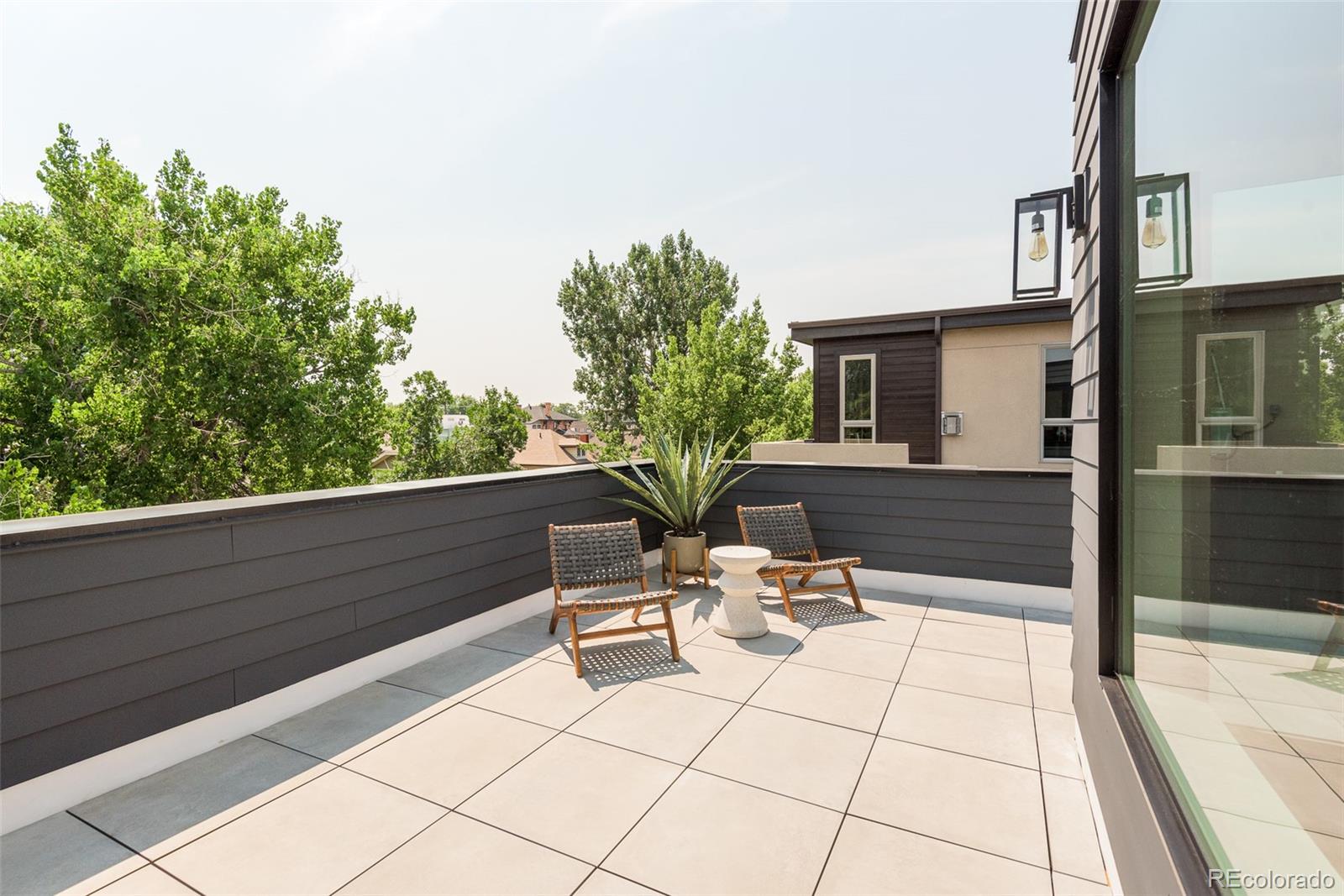 3865 Stuart Street Denver, CO 80212 - Photo 28 of 32 a view of two chairs and table in a balcony