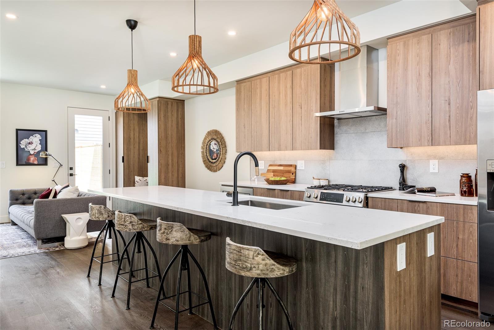 3865 Stuart Street Denver, CO 80212 - Photo 6 of 32 a kitchen with a table chairs stove and cabinets
