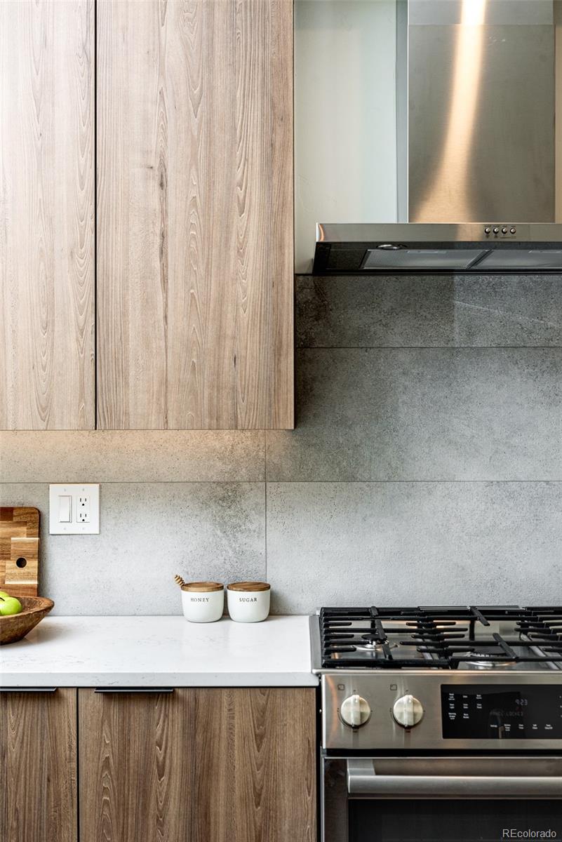 3865 Stuart Street Denver, CO 80212 - Photo 8 of 32 a kitchen with a stove and a cabinets