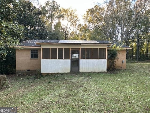135 Daniels Road Rayle, GA 30660 - Photo 1 of 1 a front view of house with yard and trees in the background