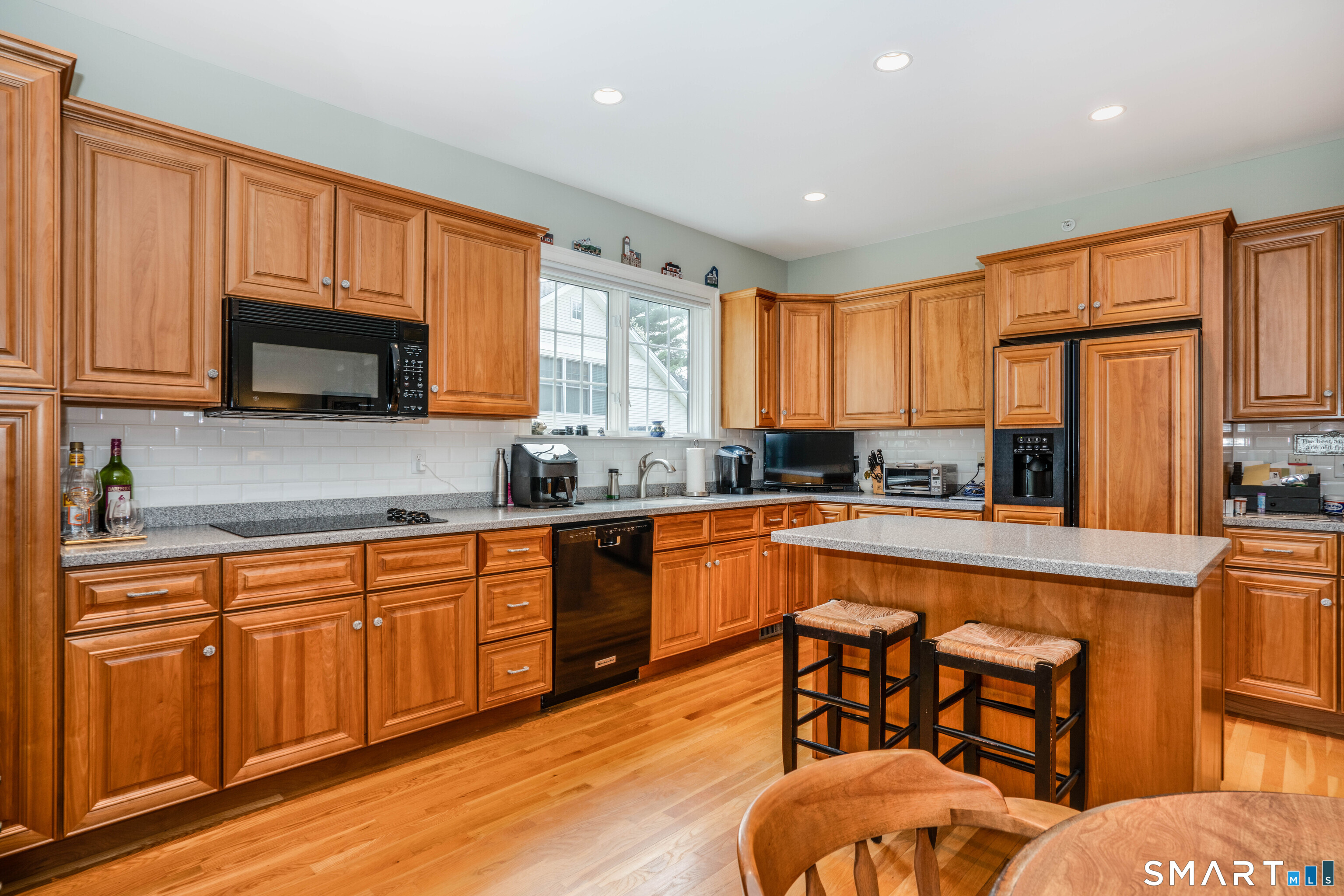 6 Bittersweet Lane, Unit 6 Avon, CT 06001 - Photo 14 of 39 a kitchen with stainless steel appliances granite countertop wooden cabinets a stove top oven a sink and dishwasher