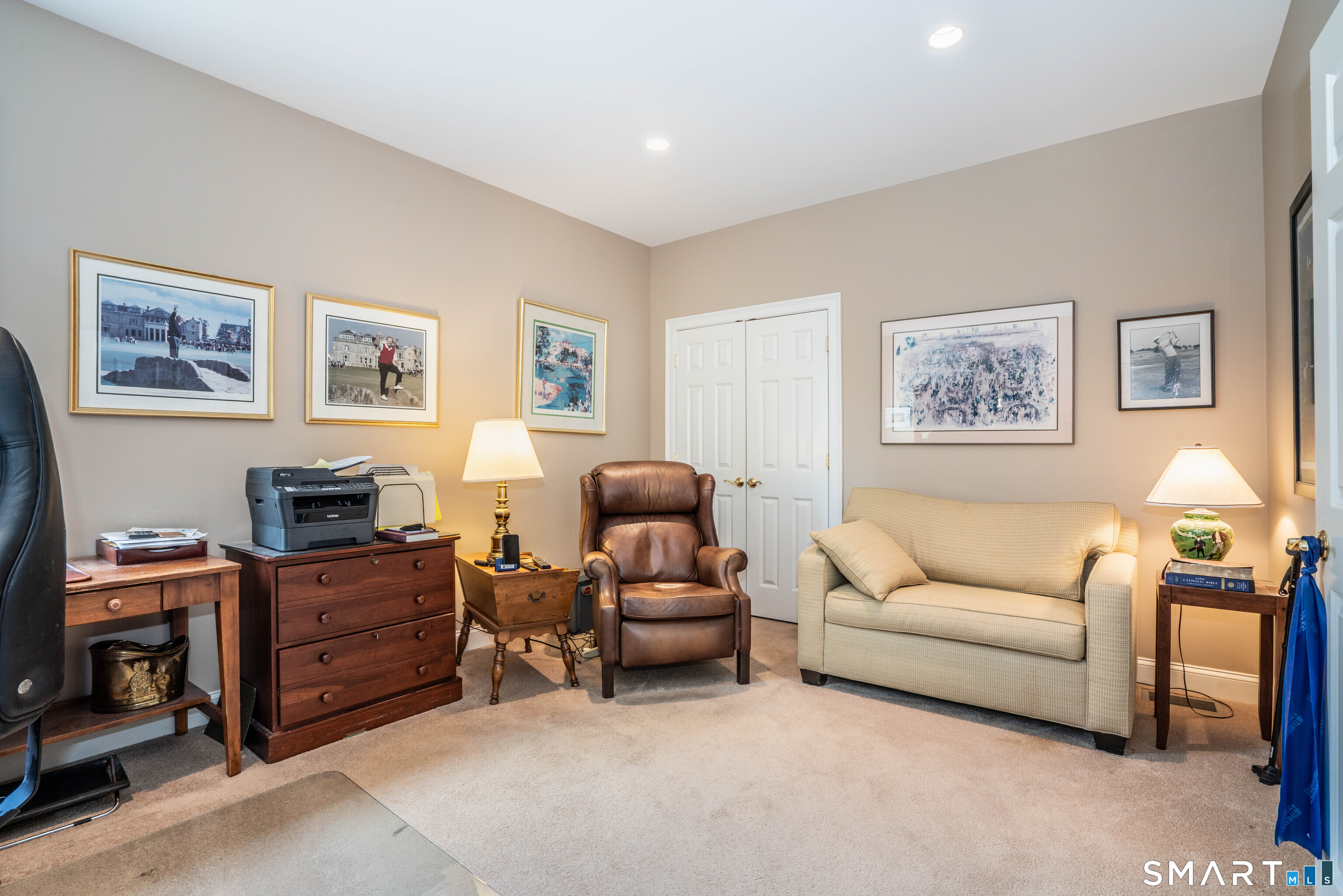 6 Bittersweet Lane, Unit 6 Avon, CT 06001 - Photo 21 of 39 a living room with furniture and a flat screen tv