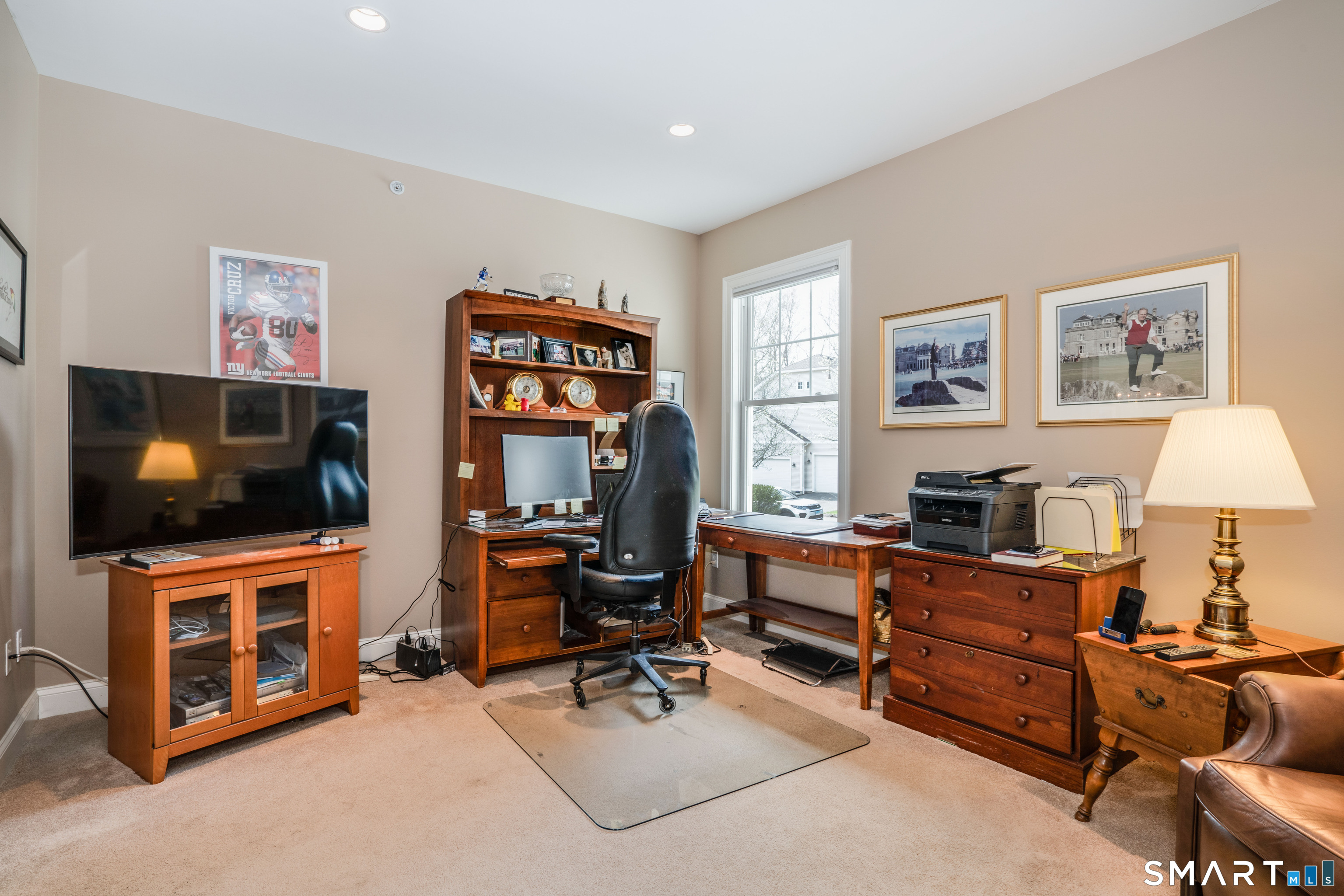 6 Bittersweet Lane, Unit 6 Avon, CT 06001 - Photo 22 of 39 a view of a livingroom with workspace and a window