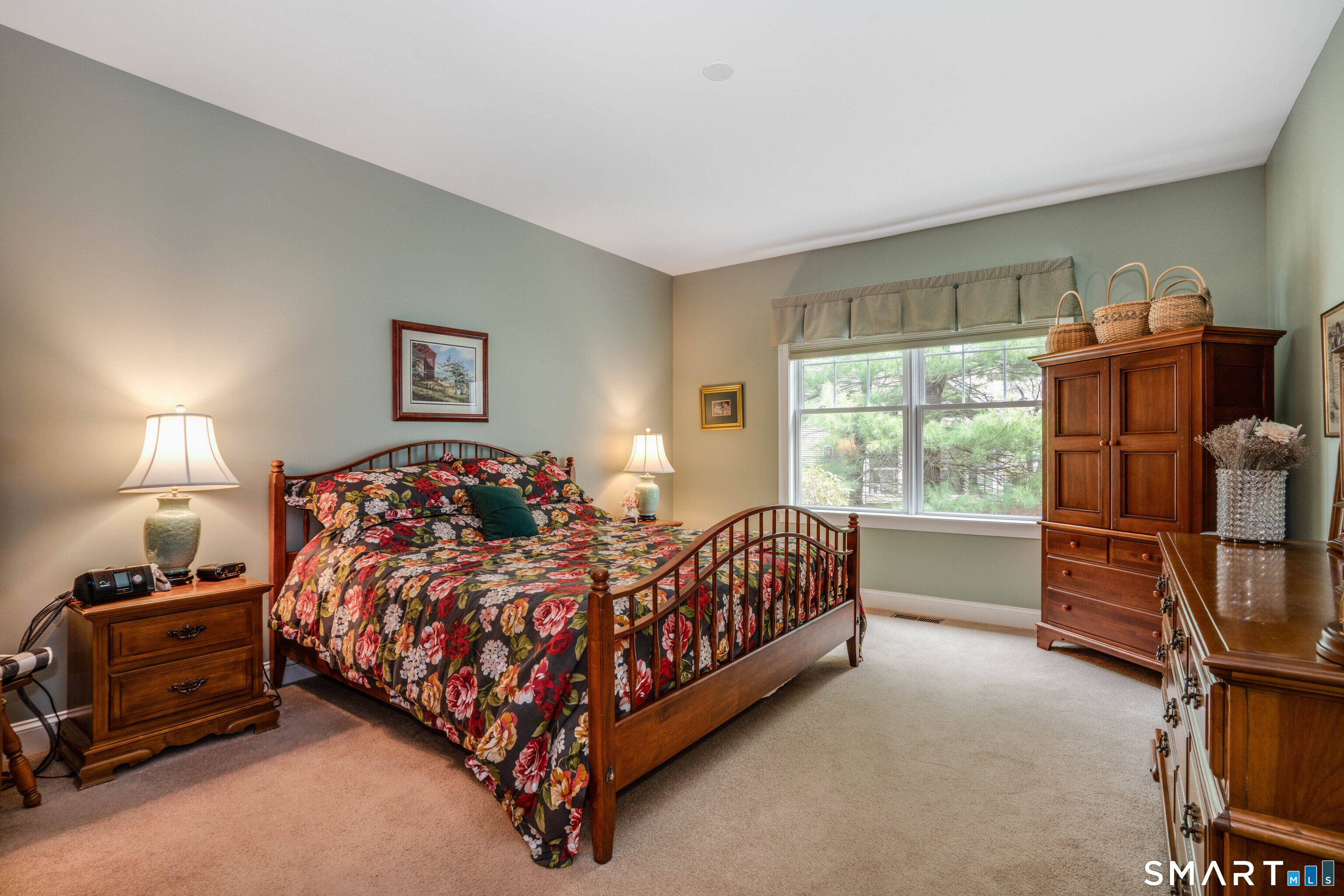 6 Bittersweet Lane, Unit 6 Avon, CT 06001 - Photo 25 of 39 a bed sitting in a room next to a window