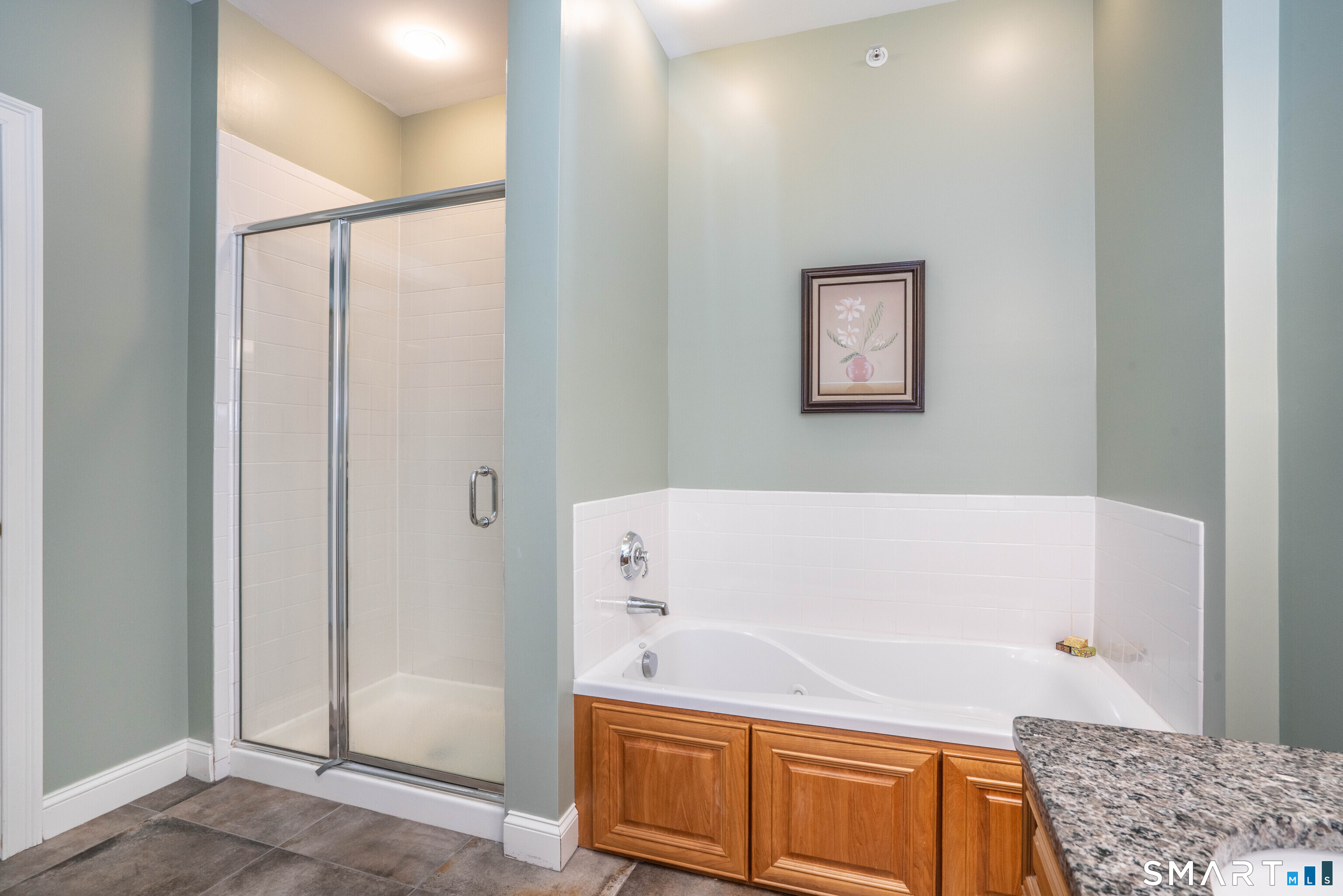 6 Bittersweet Lane, Unit 6 Avon, CT 06001 - Photo 28 of 39 a bathroom with a bathtub and a shower
