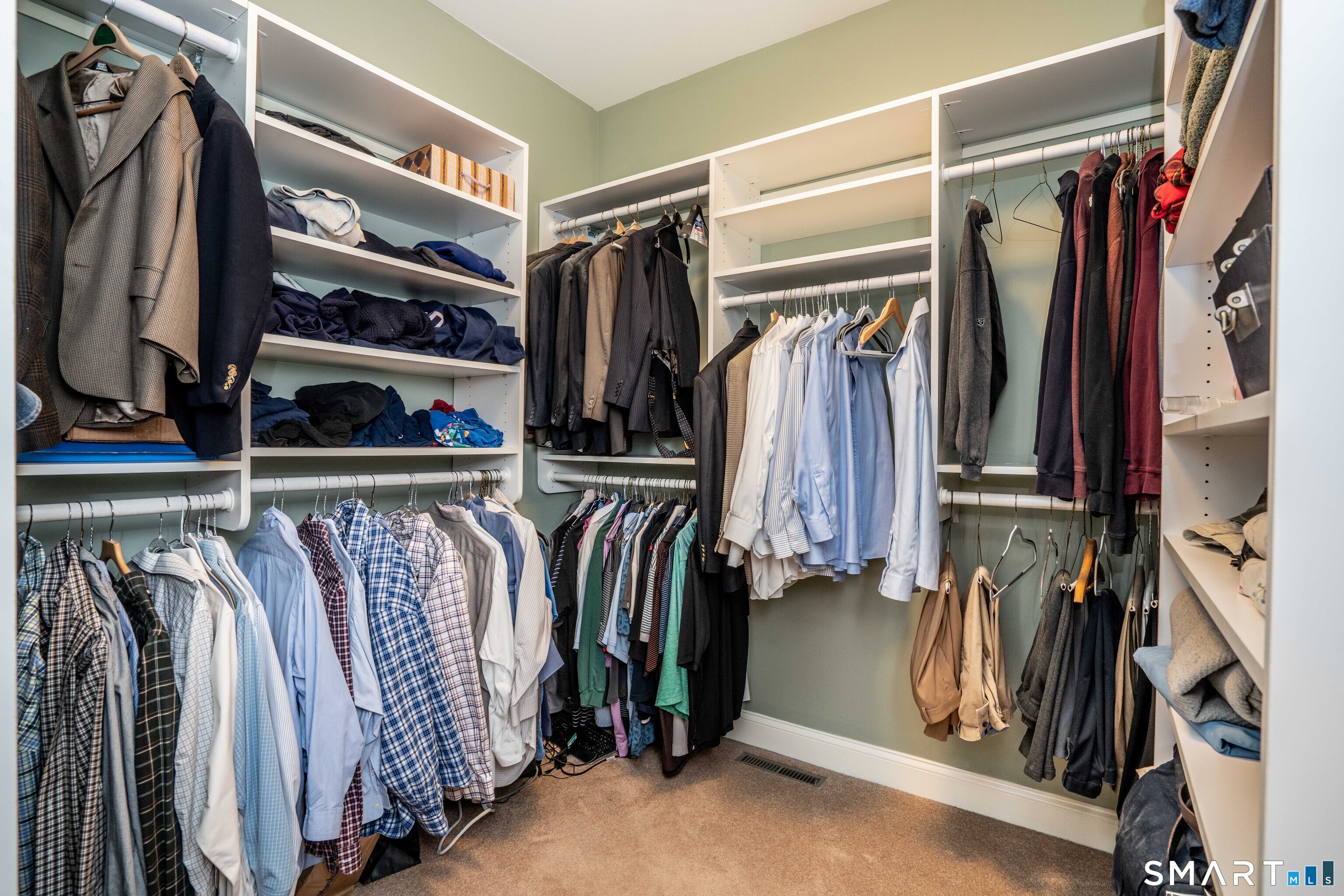 6 Bittersweet Lane, Unit 6 Avon, CT 06001 - Photo 29 of 39 a view of walk in closet with clothes and shoes