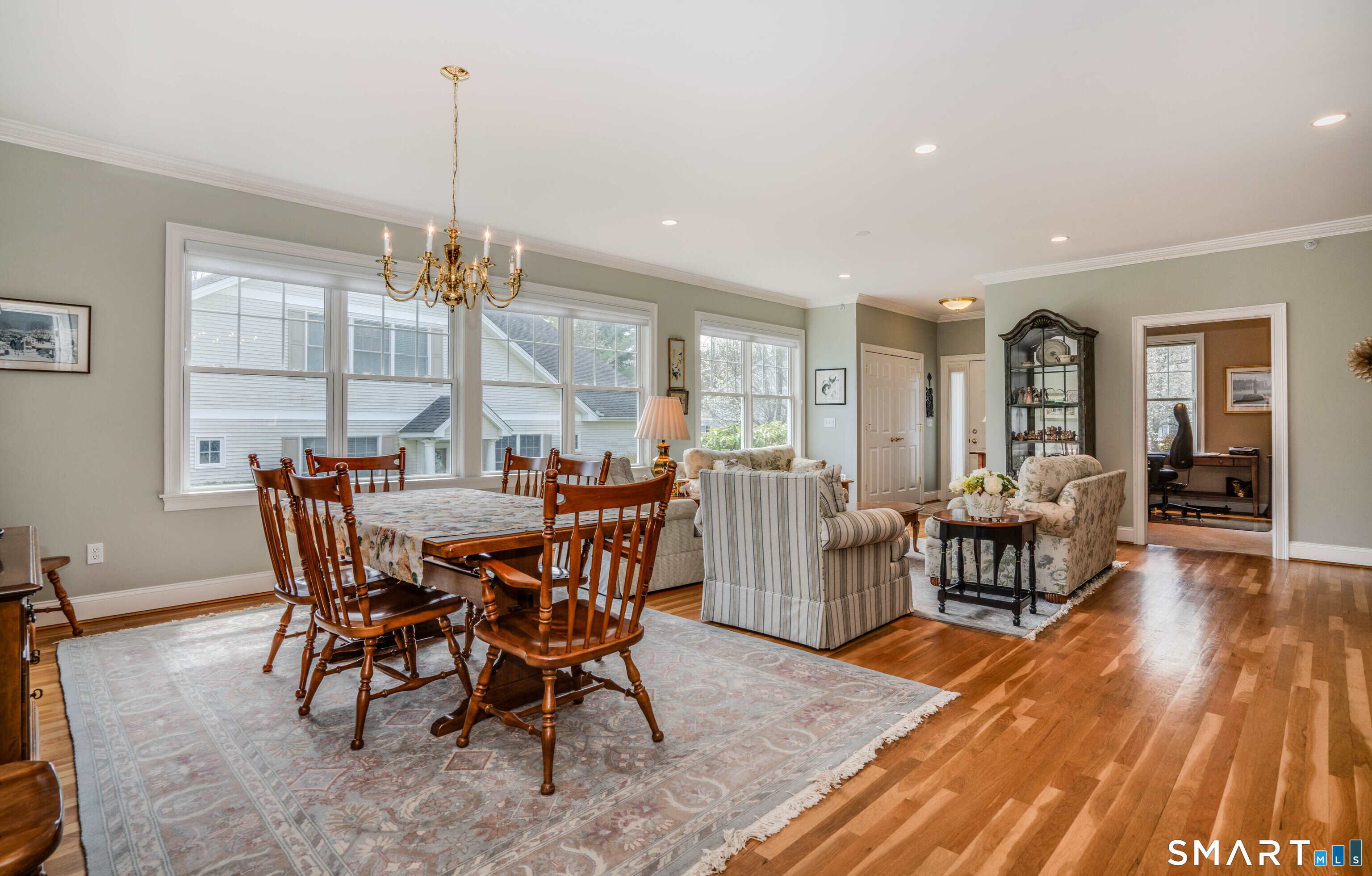 6 Bittersweet Lane, Unit 6 Avon, CT 06001 - Photo 39 of 39 a view of a dining room with furniture wooden floor and chandelier
