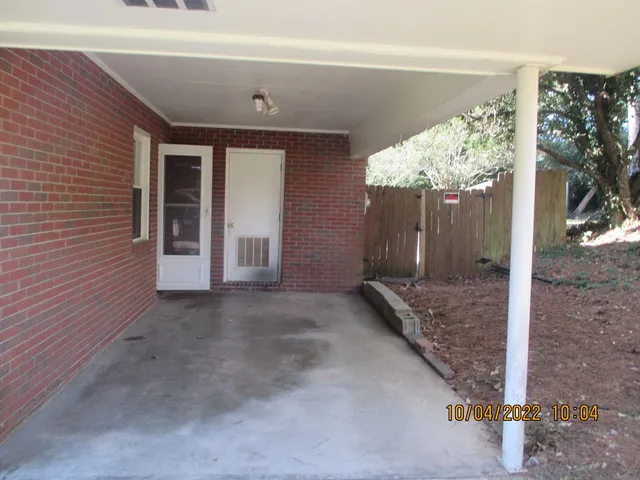 a view of a house with a yard and garage