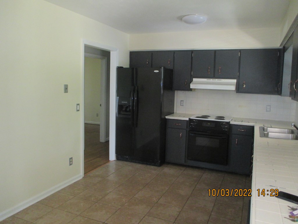 3136 Leafmore Court Columbus, GA 31909 - Photo 5 of 9 a kitchen with a stove and a refrigerator