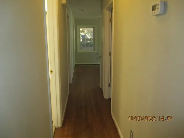 a view of a bathroom from a hallway