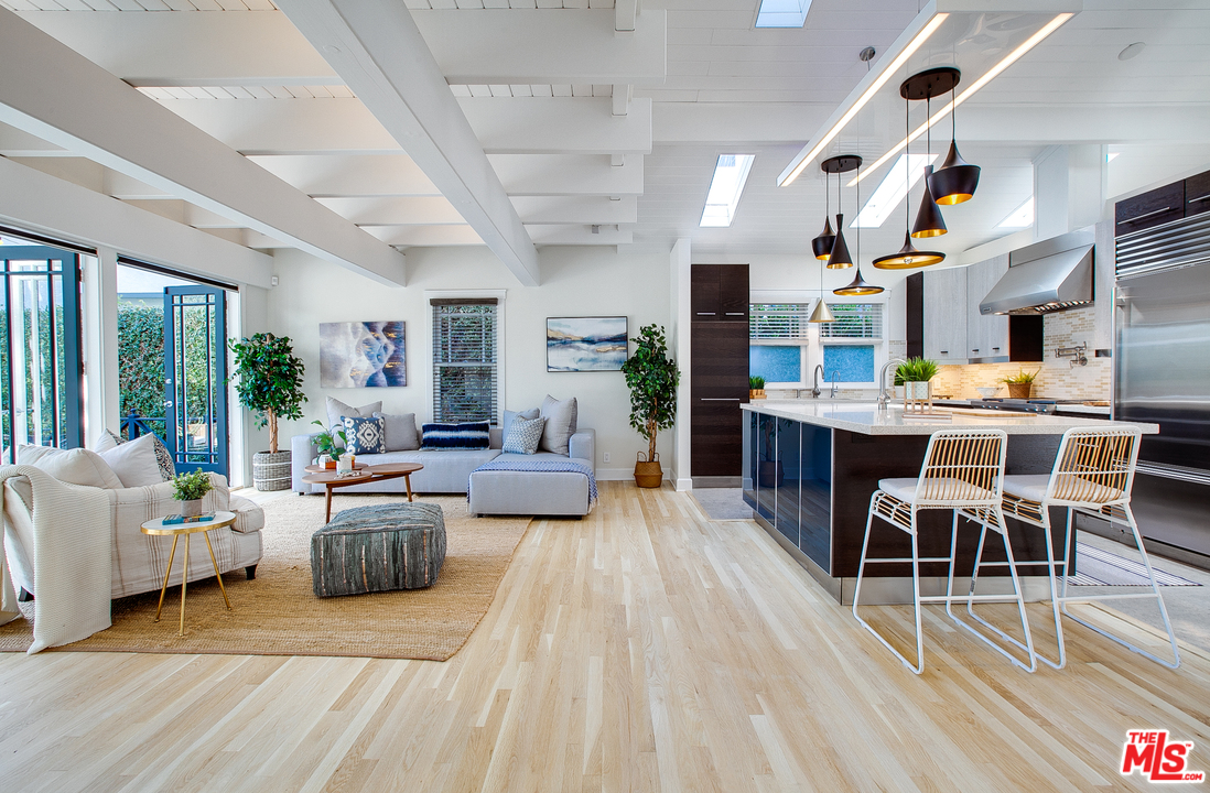 754 Palms Boulevard Venice, CA 90291 - Photo 3 of 45 a living room with fireplace furniture and a wooden floor