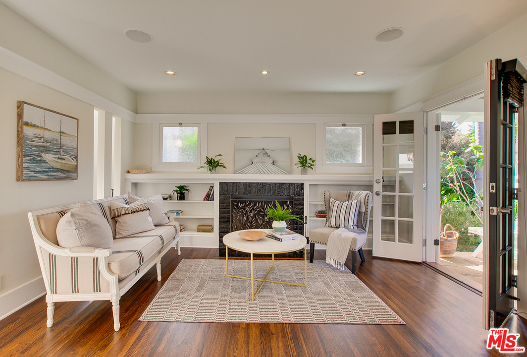 754 Palms Boulevard Venice, CA 90291 - Photo 25 of 45 a living room with furniture a window and a fireplace