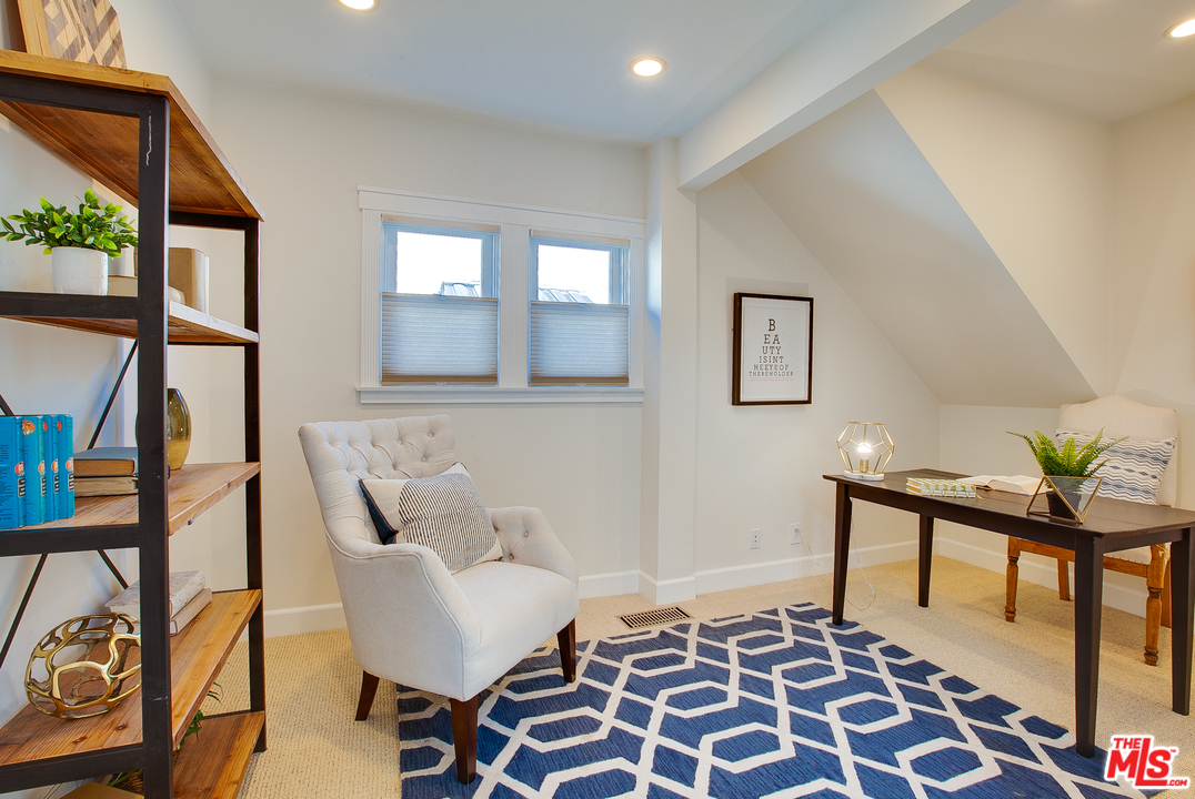 754 Palms Boulevard Venice, CA 90291 - Photo 33 of 45 a living room with furniture and a rug