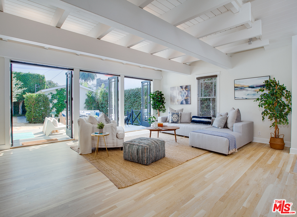 754 Palms Boulevard Venice, CA 90291 - Photo 5 of 45 a living room with furniture and a large window