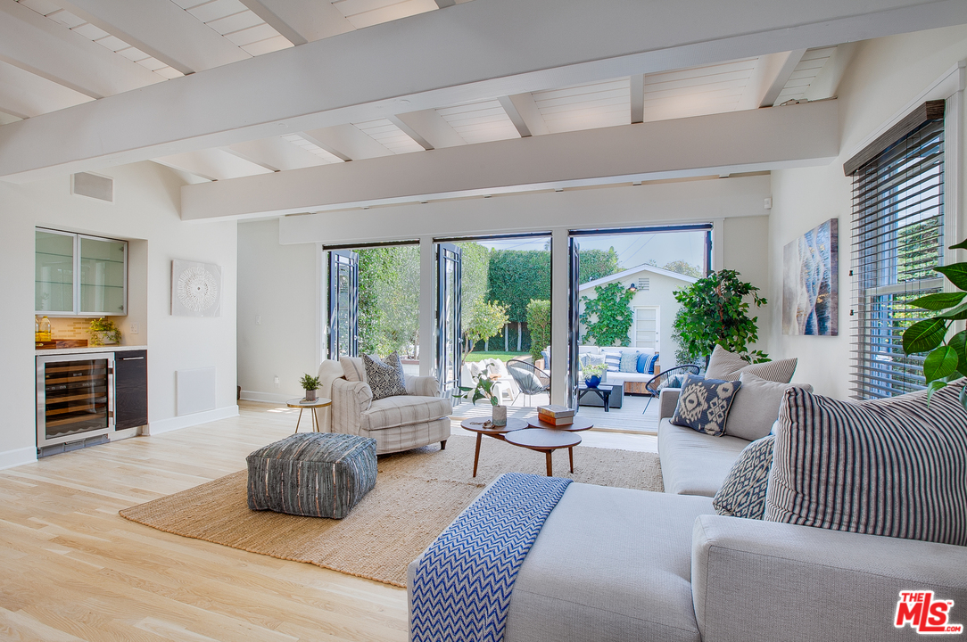 754 Palms Boulevard Venice, CA 90291 - Photo 6 of 45 a living room with furniture and large windows