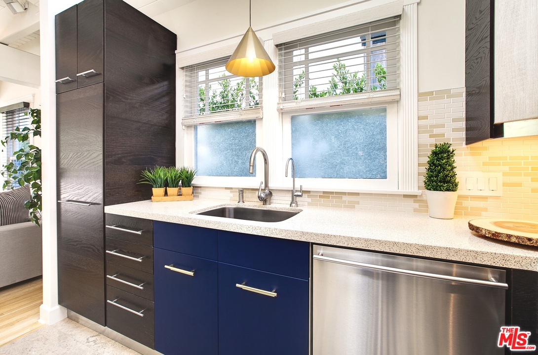 754 Palms Boulevard Venice, CA 90291 - Photo 10 of 45 a sink with a window and cabinets