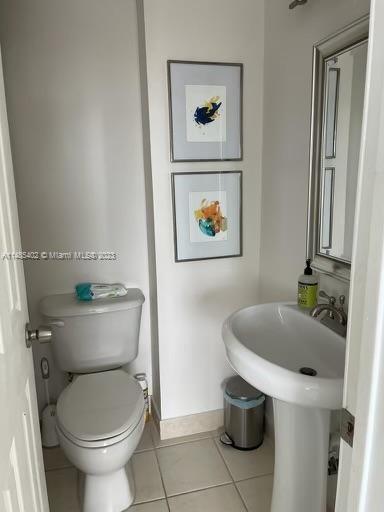 280 Southwest 20th Road, Unit 903 Miami, FL 33129 - Photo 13 of 26 a bathroom with a toilet and a sink