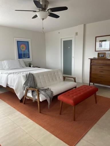 280 Southwest 20th Road, Unit 903 Miami, FL 33129 - Photo 15 of 26 a bedroom with a bed and a chandelier