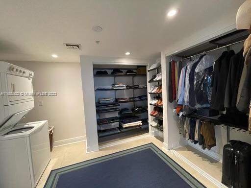 280 Southwest 20th Road, Unit 903 Miami, FL 33129 - Photo 19 of 26 a view of walk in closet with clothes and shoes