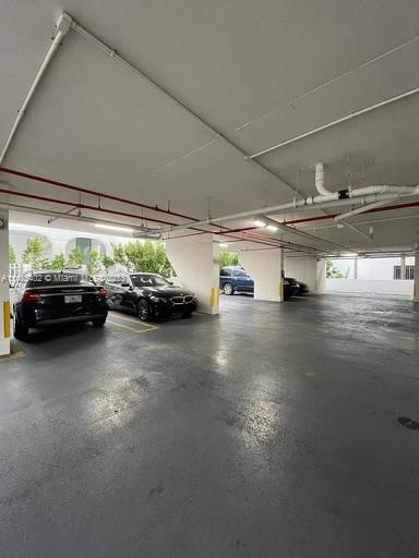280 Southwest 20th Road, Unit 903 Miami, FL 33129 - Photo 23 of 26 a view of parking garage with cars