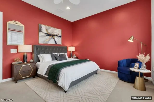 a bedroom with a bed and a night stand