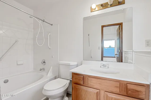a bathroom with a shower curtain and a toilet