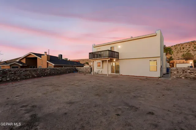 a view of a balcony with chairs